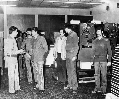 Saddam Hussein visiting a state paper press, Baghdad, Iraq by Unbekannt