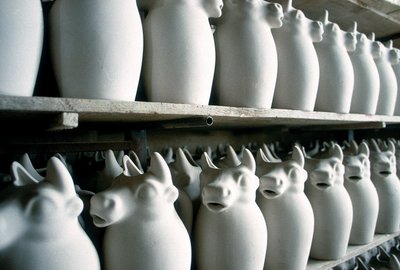 Shelves inside a ceramic factory with some milk jugs, Montelupo Fiorentino, Italy by Unbekannter Künstler