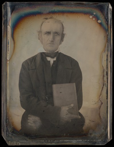 Portrait of a Man with Muttonchop Whiskers Clutching a Book by Unknown artist