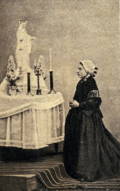 Bernadette Soubirous Kneeling Before an Altar with the Virgin by Unknown photographer
