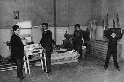 Everyday life, scene of moving in a building in Paris. Photography, late 19th century, Paris. Coll. Selva by Unknown photographer