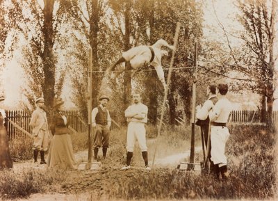 Portrait of a man who trains in the pole vaulting in front of some spectators by Unknown photographer