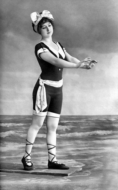 Woman in Swimsuit and Beach Shoe by Unknown photographer