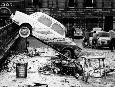 An automobile thrown over a balustrade in the Via dei Renai during the flood of Florence, November 1966 by Vincenzo Balocchi