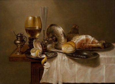 A Still Life with a Roemer, An Overturned Silver Tazza, a Flute, a Bread Roll and Ham on a Table by Willem Claesz. Heda