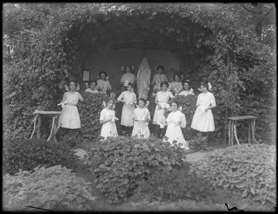 Graduating Class of Girls from the Roman Catholic Orphan Asylum Posed Before the Grotto with Their Diplomas by William Davis Hassler