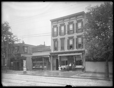Seven Children Pose in Front of an Unidentified Branch of the Queens Borough Public Library, New York, c.1910 by William Davis Hassler