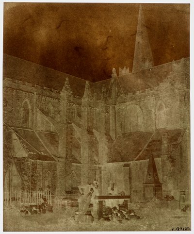 Two men pose in the graveyard of St. Patrick