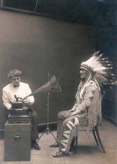 Piegan Indian, Mountain Chief, Listening to a Recording with Ethnologist Frances Densmore by . .