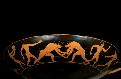 Attic cup with red figures representing athletes in training, a discobole and wrestlers by painter Euergides