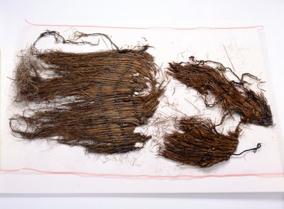 Fragments From A Loose Sleeveless Cloak Found With The 257544
