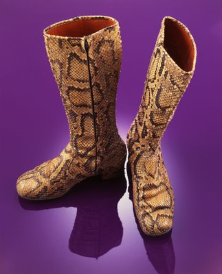 A pair of knee length snakeskin boots worn by Brian Jones in the