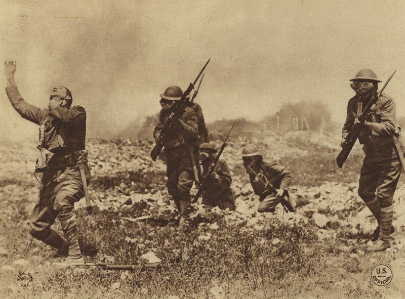America in World War I: Danger from gas attacks was impressed on our men by every means in order to enforce obedience to the army orders concerning the carrying and wearing of gas masks by American Photographer