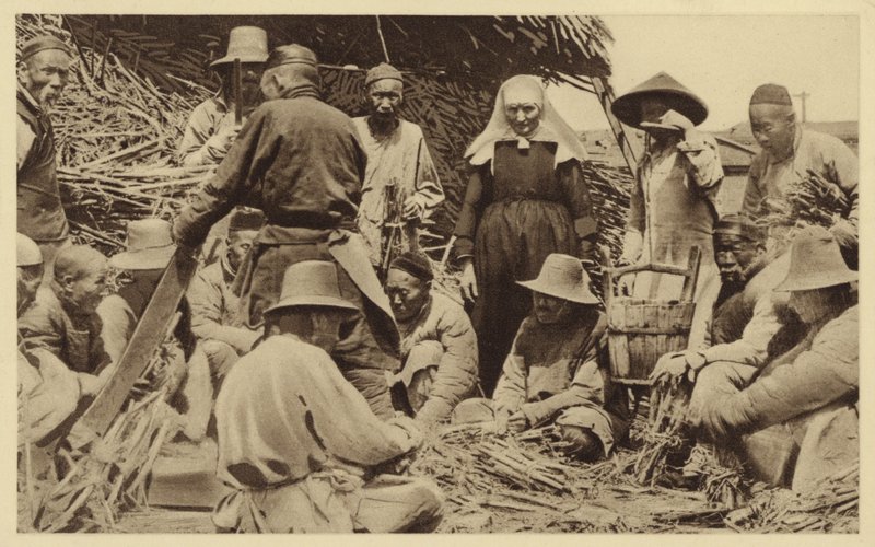 A Missionary Standing Among Villagers in China by English Photographer