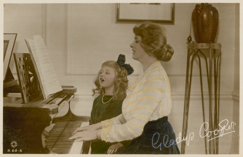 Gladys Cooper and girl at piano by English Photographer