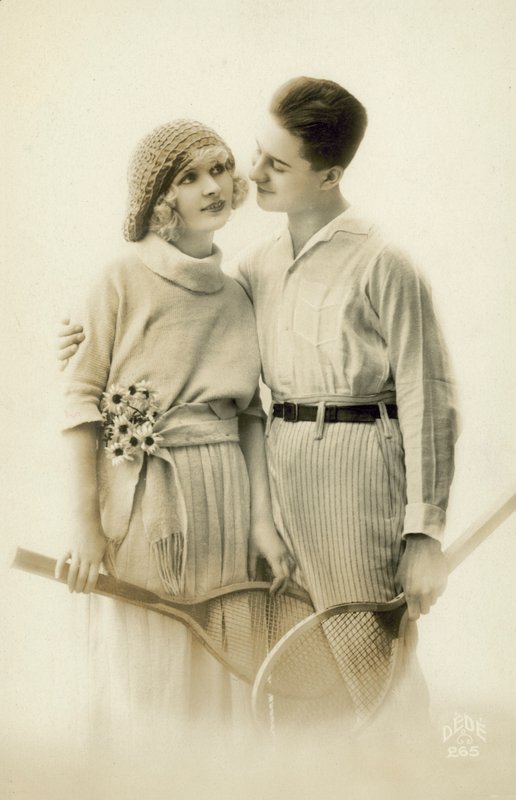 Couple with Tennis Rackets by European Photographer