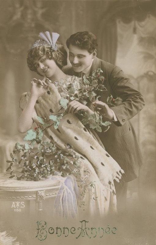 Happy New Year Greetings Card with Romantic Couple Holding Mistletoe by French Photographer