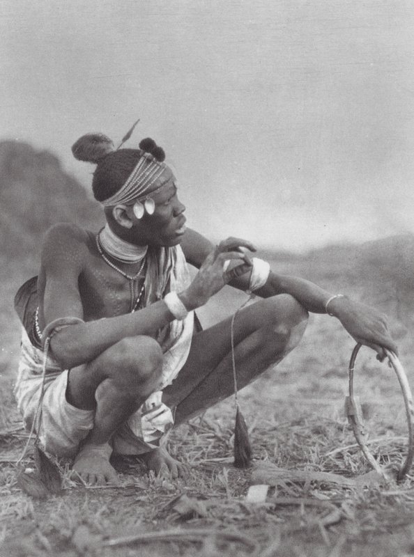 Africa: Dinka Bridegroom Bargaining for the Bridal Ornaments by Hugo Adolf Bernatzik