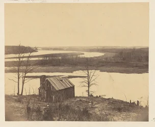 House on Shore of River