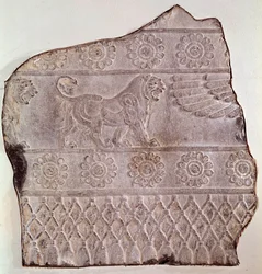 Fragment of low relief representing a walking lion, from Persepolis