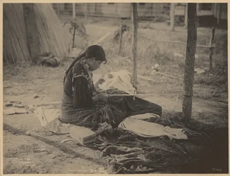 Woman of the Meskwaki Nation Engaging in Beadwork