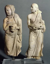 Two statuettes of standing monks, from Hadda