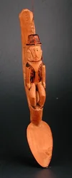 Figure of a European man seated on shaft of a spoon, South East Africa, late 19th century