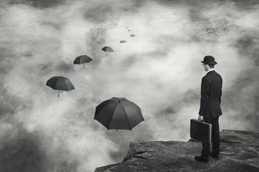 Man and Floating Umbrellas