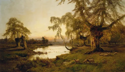 Sheep Grazing by a Lake at Sunset