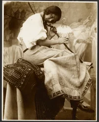 Seated Female Model Holding Tree Branch