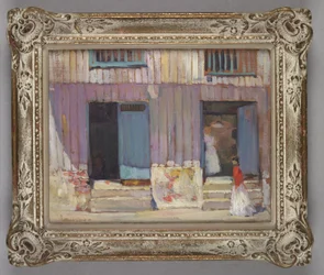 Woman walking in front of buildings