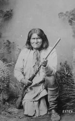 Geronimo holding a rifle, 1884