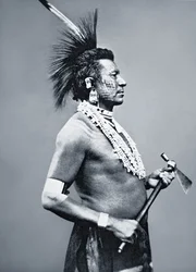 Osage Tribe Warrior with tomahawk pipe, c.1875