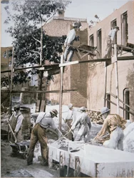 African Americans building an extension onto the Negro Industrial Institute at Tuskegee, Alabama