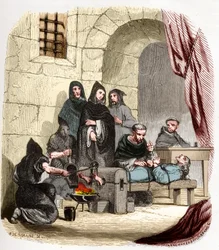 Inquisition in Spain in the 15th century: Mary of Burgundy (1457-1482), accused of being Jewish, is tortured by Saint Peter (Pedro) of Arbues (1441/1442-1485), Spanish inquisitor: he is burning her feet. Illustration in “Mysteries of the Inquisition” and