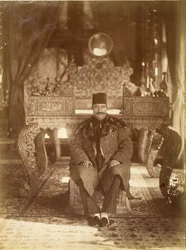 Nasruddin Shah sitting in front of the Peacock Throne, Gulistan Palace, Tehran