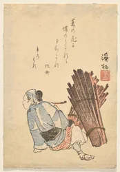 Woman wood-gatherer pauses to smoke a pipe