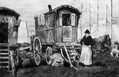 Camp of gypsies with their horse-drawn caravan
