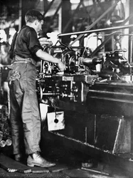A tradesman making shell casings at a Walsh Island mill, Newcastle, New South Wales, c.1916