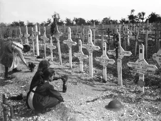 French children tending graves at Adelaide Cemetery of Australians killed in battle on the Western Front, Villers-Bretonneux, France 26 August 1919