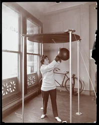 Edna Wallace Hopper hitting a punching bag at Jack Cooper