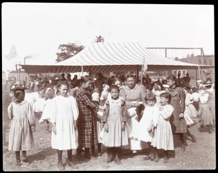 Group of girls and a woman at the Hudson Bank Gymnasium and Playground, 53rd Street and 11th Avenue, New York, 1898