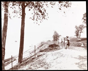 View of a Boy with a Spyglass Looking Toward the Hudson River from Riverside Park, New York