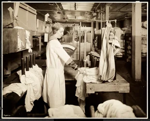 Women tagging bags of laundry at the Carolyn Laundry, East Harlem, New York, 1928