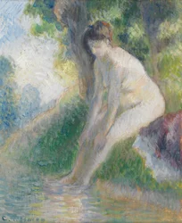Woman Sitting on Bank of Stream