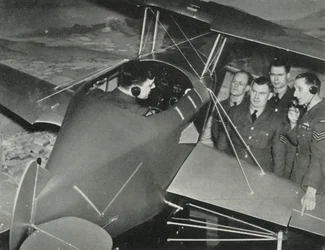 RAF personnel learning to fly in a flight simulator during the Second World War