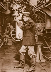 British Submarine Officer Examining the Periscope
