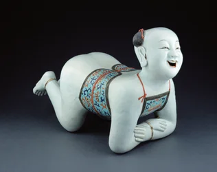 Chinese Porcelain Pillow in the Form of a Semi-Naked Boy