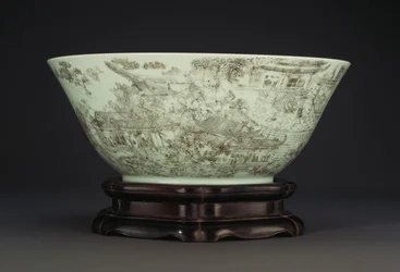 A large incised porcelain bowl depicting a continuous scene of ladies in the palace grounds