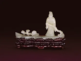 Zhang Qian standing on a log raft steering with a branch of lingzhi beside a branch of lingzhi and a peach